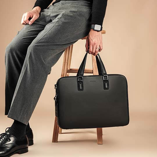 Saffiano Leather Briefcase vs Nylon Backpack: Which One Reads Right in a Client Meeting?